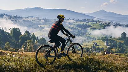 male-cyclist-riding-bicycle-mountains